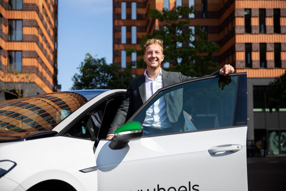 Man in front of MyWheels car